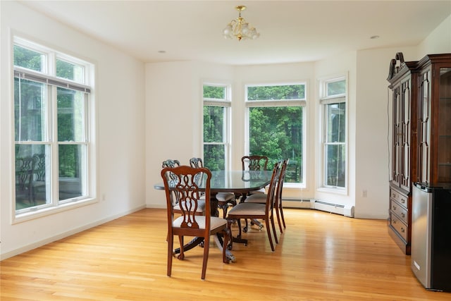 9 Golf Course Dr, Suffern, NY 10901 - dining room with light wood-type flooring, a baseboard heating unit, a chandelier, and baseboards