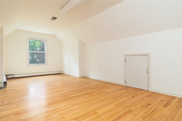 9 Golf Course Dr, Suffern, NY 10901 - bonus room with a baseboard radiator, light wood finished floors, and vaulted ceiling