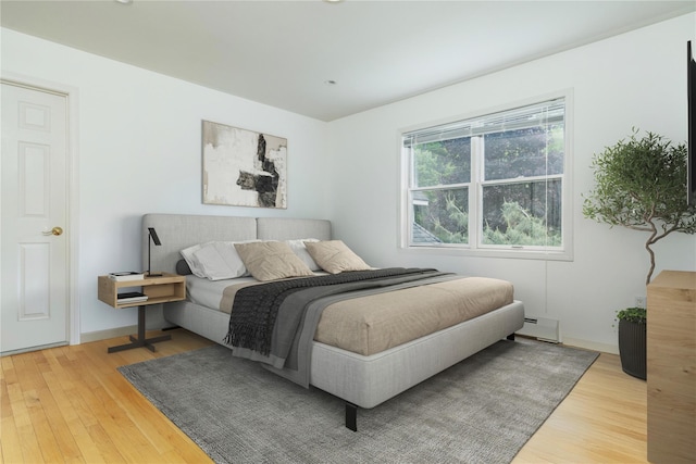 9 Golf Course Dr, Suffern, NY 10901 - bedroom with a baseboard radiator and wood finished floors