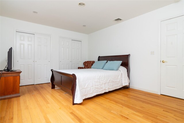 9 Golf Course Dr, Suffern, NY 10901 - bedroom featuring multiple closets and light wood-style flooring