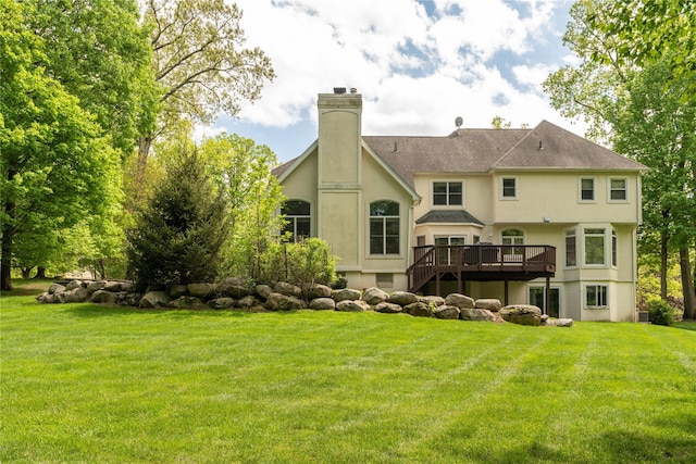 9 Golf Course Dr, Suffern, NY 10901 - rear view of property featuring a deck, a chimney, stucco siding, and a lawn