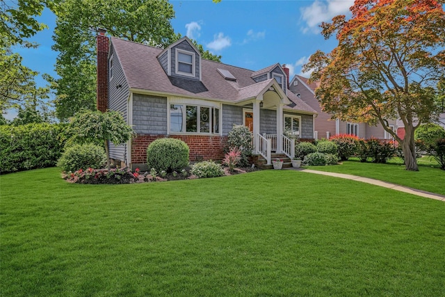 1784 W End Ave, New Hyde Park, NY 11040 - view of front of house with a front lawn, a chimney, and a shingled roof