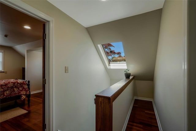 1784 W End Ave, New Hyde Park, NY 11040 - staircase featuring a skylight, wood finished floors, baseboards, recessed lighting, and vaulted ceiling