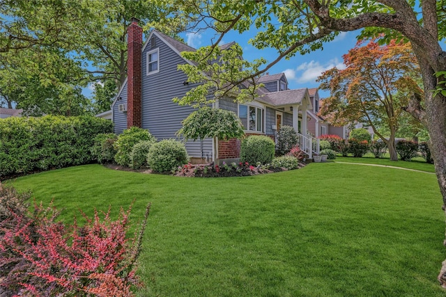 1784 W End Ave, New Hyde Park, NY 11040 - view of side of home featuring a yard and a chimney