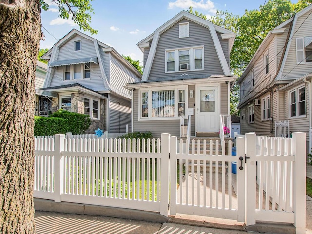 4428 Bruner Ave, Bronx, NY 10466 - dutch colonial with a gambrel roof, a gate, and a fenced front yard
