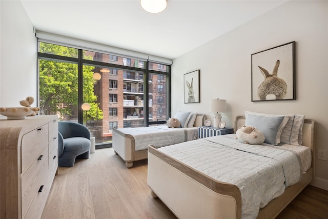 bedroom featuring wood finished floors