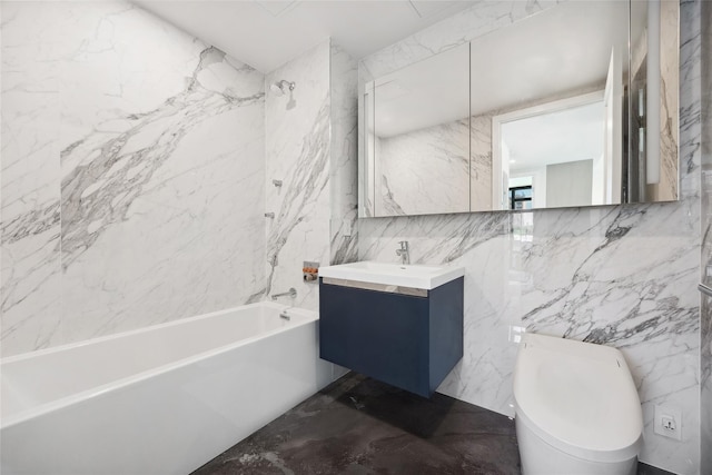 bathroom with tile walls, bathtub / shower combination, toilet, vanity, and marble finish floors