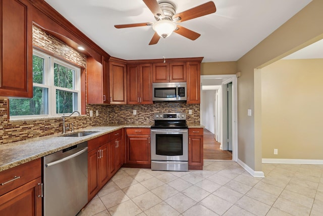 20 Ravensdale Rd, Hastings-On-Hudson, NY 10706 - kitchen with stainless steel appliances, decorative backsplash, light stone counters, and ceiling fan