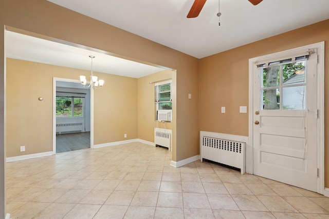 20 Ravensdale Rd, Hastings-On-Hudson, NY 10706 - spare room with radiator, a ceiling fan, and a chandelier