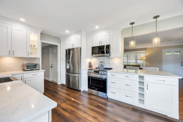30 Twisting Dr, Lake Grove, NY 11755 - kitchen with appliances with stainless steel finishes, dark wood-style flooring, decorative backsplash, white cabinetry, and recessed lighting