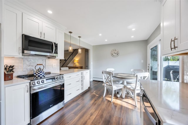 30 Twisting Dr, Lake Grove, NY 11755 - kitchen with appliances with stainless steel finishes, decorative backsplash, dark wood finished floors, white cabinetry, and recessed lighting