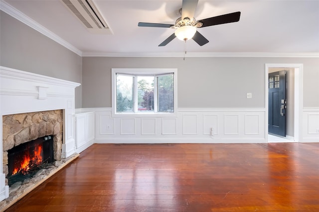 21 Livingston St, Deer Park, NY 11729 - unfurnished living room with a stone fireplace, ceiling fan, hardwood / wood-style floors, ornamental molding, and a wainscoted wall