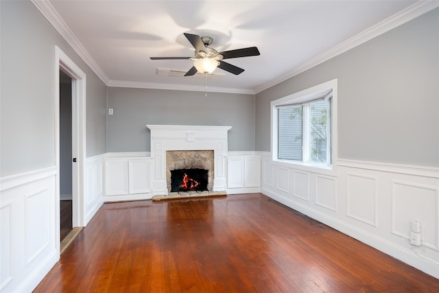 21 Livingston St, Deer Park, NY 11729 - unfurnished living room with ceiling fan, a fireplace, dark wood-type flooring, crown molding, and a wainscoted wall
