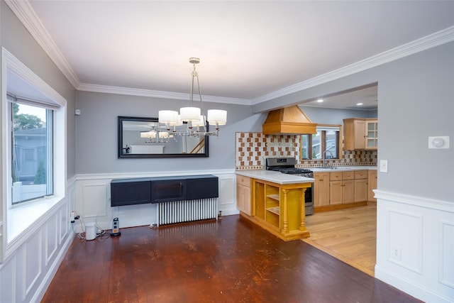 21 Livingston St, Deer Park, NY 11729 - kitchen with gas stove, wood finished floors, a chandelier, light countertops, and crown molding