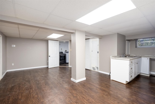 21 Livingston St, Deer Park, NY 11729 - basement with a sink, washer / clothes dryer, dark wood-style flooring, and a paneled ceiling