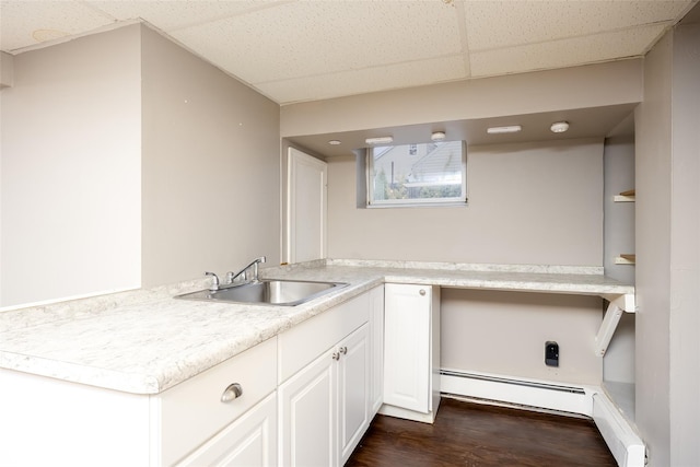 21 Livingston St, Deer Park, NY 11729 - washroom with a sink, dark wood finished floors, and a baseboard radiator