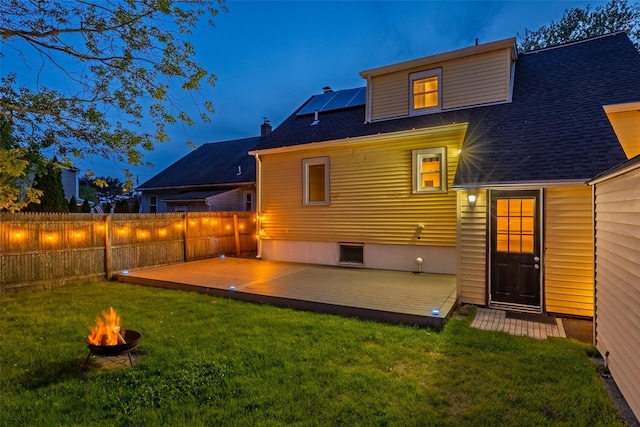 21 Livingston St, Deer Park, NY 11729 - back of house with an outdoor fire pit, a deck, and roof with shingles