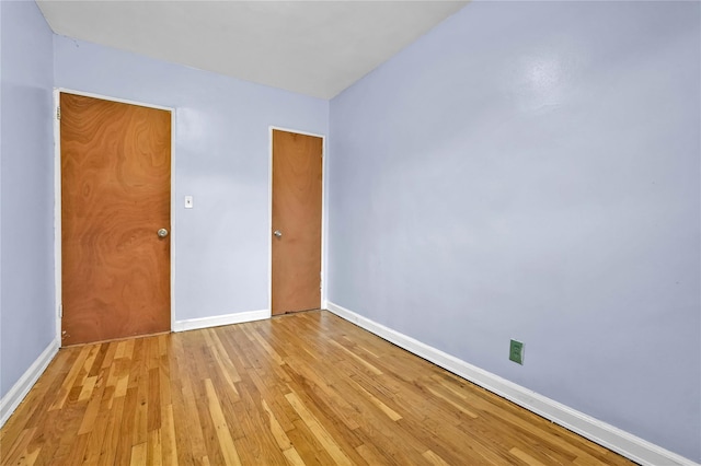 1141 E 213th St, Bronx, NY 10469 - spare room featuring baseboards and light wood-style floors