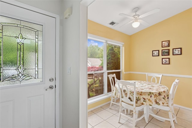 552 Birchwood Park Dr, Middle Island, NY 11953 - dining space with light tile patterned floors, a ceiling fan, and baseboards