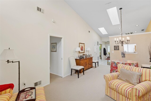 552 Birchwood Park Dr, Middle Island, NY 11953 - living room with a chandelier, a skylight, light colored carpet, high vaulted ceiling, and baseboards