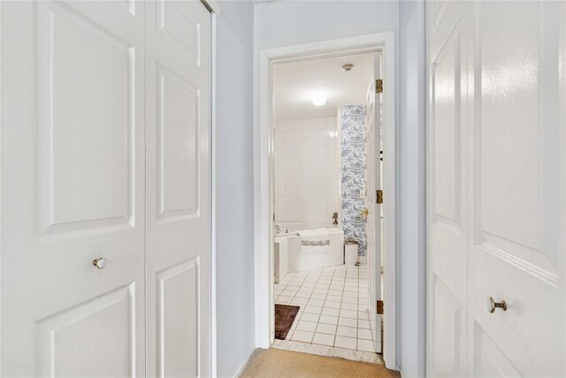 552 Birchwood Park Dr, Middle Island, NY 11953 - hall featuring light tile patterned floors and baseboards