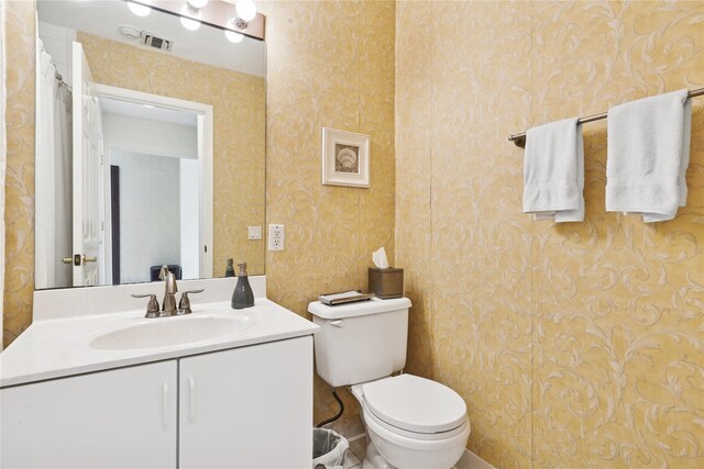 552 Birchwood Park Dr, Middle Island, NY 11953 - bathroom with wallpapered walls, toilet, and vanity