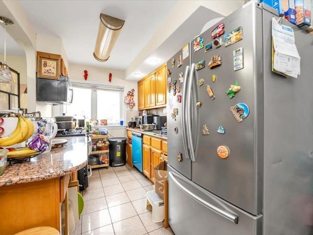 150-31 78th Ave, Flushing, NY 11367 - kitchen with freestanding refrigerator, dishwashing machine, light tile patterned floors, and brown cabinets