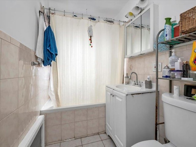 150-31 78th Ave, Flushing, NY 11367 - full bath with tile walls, toilet, tiled shower / bath, tile patterned floors, and vanity