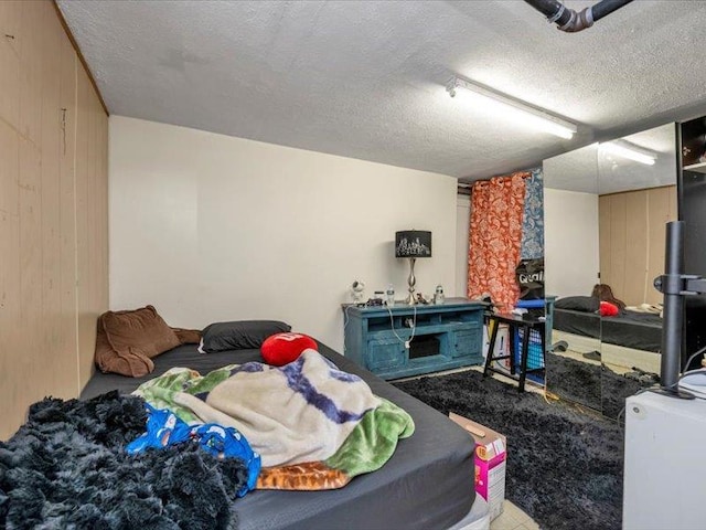 150-31 78th Ave, Flushing, NY 11367 - bedroom with a textured ceiling, wooden walls, and carpet flooring