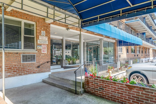 190 W Merrick Rd Unit 4E, Freeport, NY 11520 - property entrance with brick siding