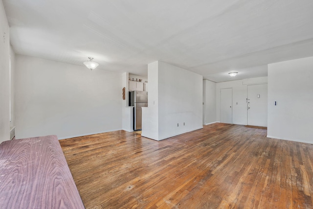 190 W Merrick Rd Unit 4E, Freeport, NY 11520 - unfurnished room featuring wood-type flooring