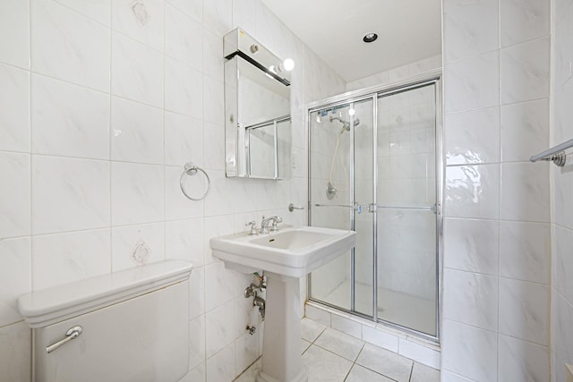 190 W Merrick Rd Unit 4E, Freeport, NY 11520 - full bathroom with tile walls, a shower stall, and tile patterned floors