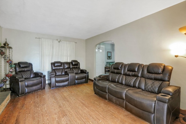 100 Harwich St, Kingston, NY 12401 - living area with arched walkways and light wood-style floors