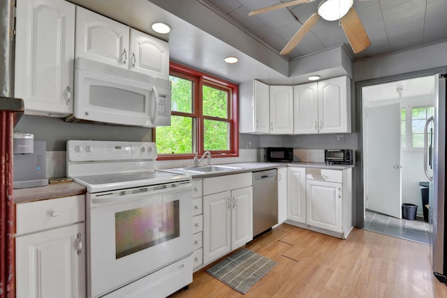 100 Harwich St, Kingston, NY 12401 - kitchen featuring stainless steel appliances, a sink, white cabinetry, light wood-type flooring, and recessed lighting