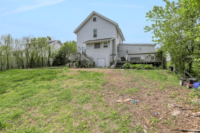 100 Harwich St, Kingston, NY 12401 - back of house with a deck, stairs, and a lawn