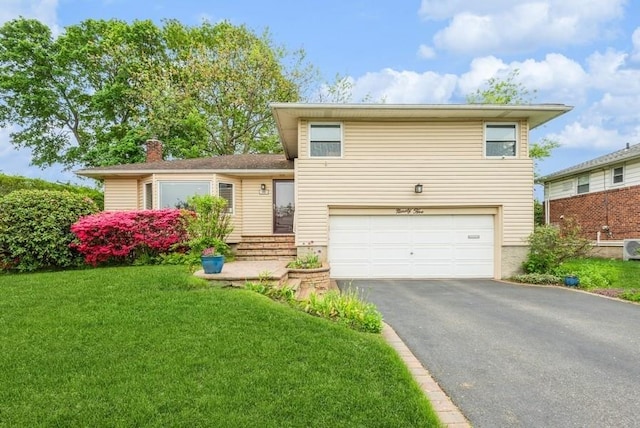 95 Nassau Ave, Plainview, NY 11803 - tri-level home featuring an attached garage, a front lawn, asphalt driveway, and a chimney