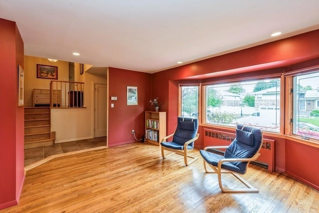 95 Nassau Ave, Plainview, NY 11803 - living area featuring wood finished floors, stairway, baseboards, and recessed lighting