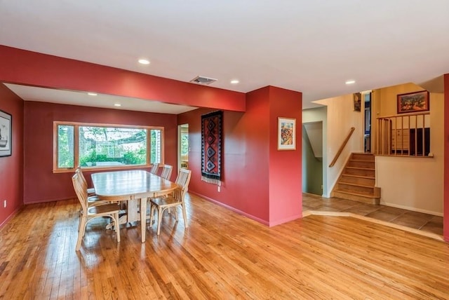 95 Nassau Ave, Plainview, NY 11803 - dining area with light wood-type flooring, stairs, baseboards, and recessed lighting