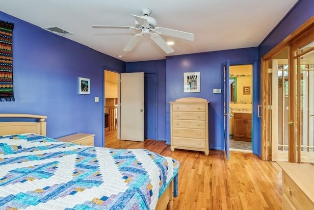 95 Nassau Ave, Plainview, NY 11803 - bedroom with wood finished floors, a ceiling fan, baseboards, and ensuite bath