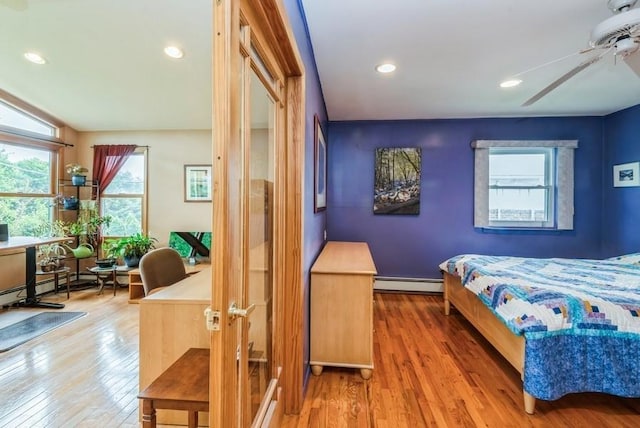 95 Nassau Ave, Plainview, NY 11803 - bedroom with a baseboard heating unit, hardwood / wood-style flooring, and recessed lighting