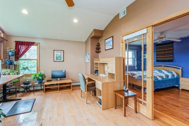 95 Nassau Ave, Plainview, NY 11803 - bedroom with a desk, vaulted ceiling, wood finished floors, multiple windows, and a baseboard heating unit