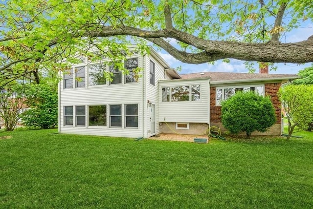 95 Nassau Ave, Plainview, NY 11803 - rear view of property featuring a chimney and a yard