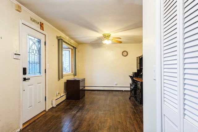 entryway with a baseboard radiator, dark wood-style flooring, a ceiling fan, ornamental molding, and baseboards