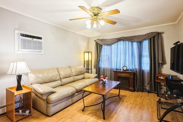 living room featuring ceiling fan, light wood-type flooring, a wall mounted AC, baseboard heating, and crown molding