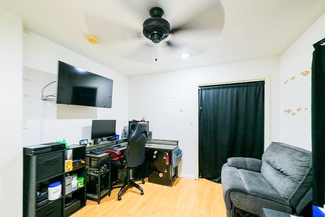 office area featuring a ceiling fan and light wood-style floors
