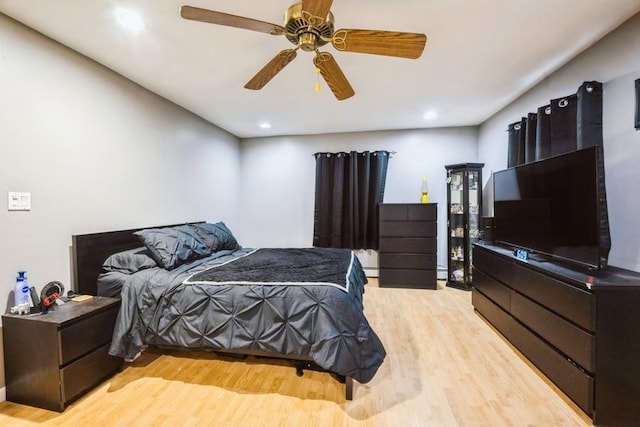 bedroom featuring light wood-type flooring, recessed lighting, and ceiling fan