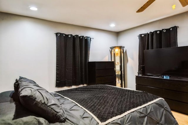 bedroom with wood finished floors, recessed lighting, and a ceiling fan