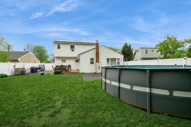 rear view of house featuring a deck