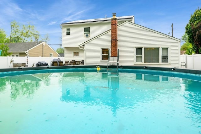 view of swimming pool featuring a fenced backyard