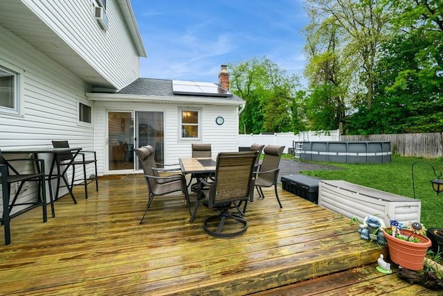 wooden terrace featuring outdoor dining space